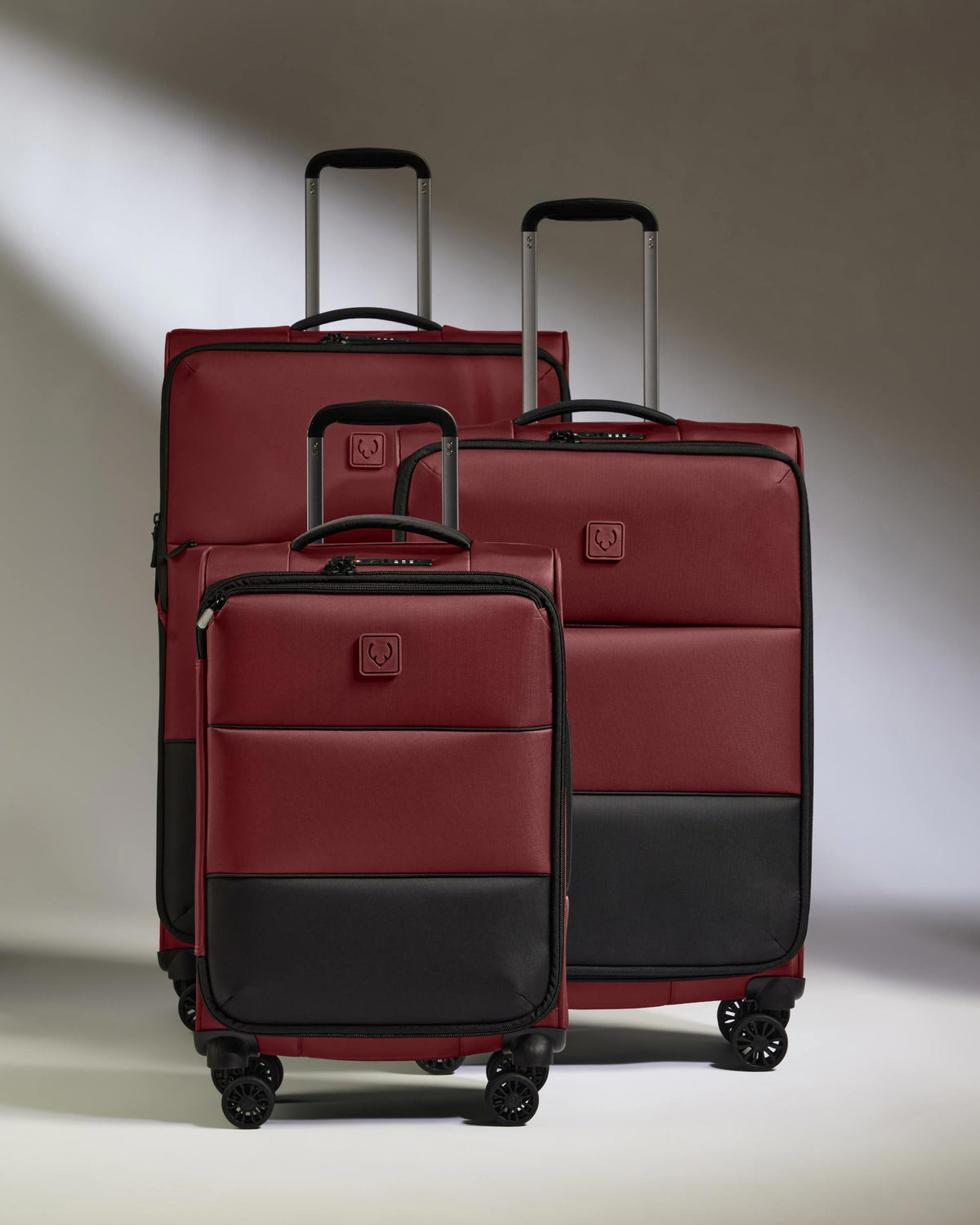 a group of luggage on wheels
