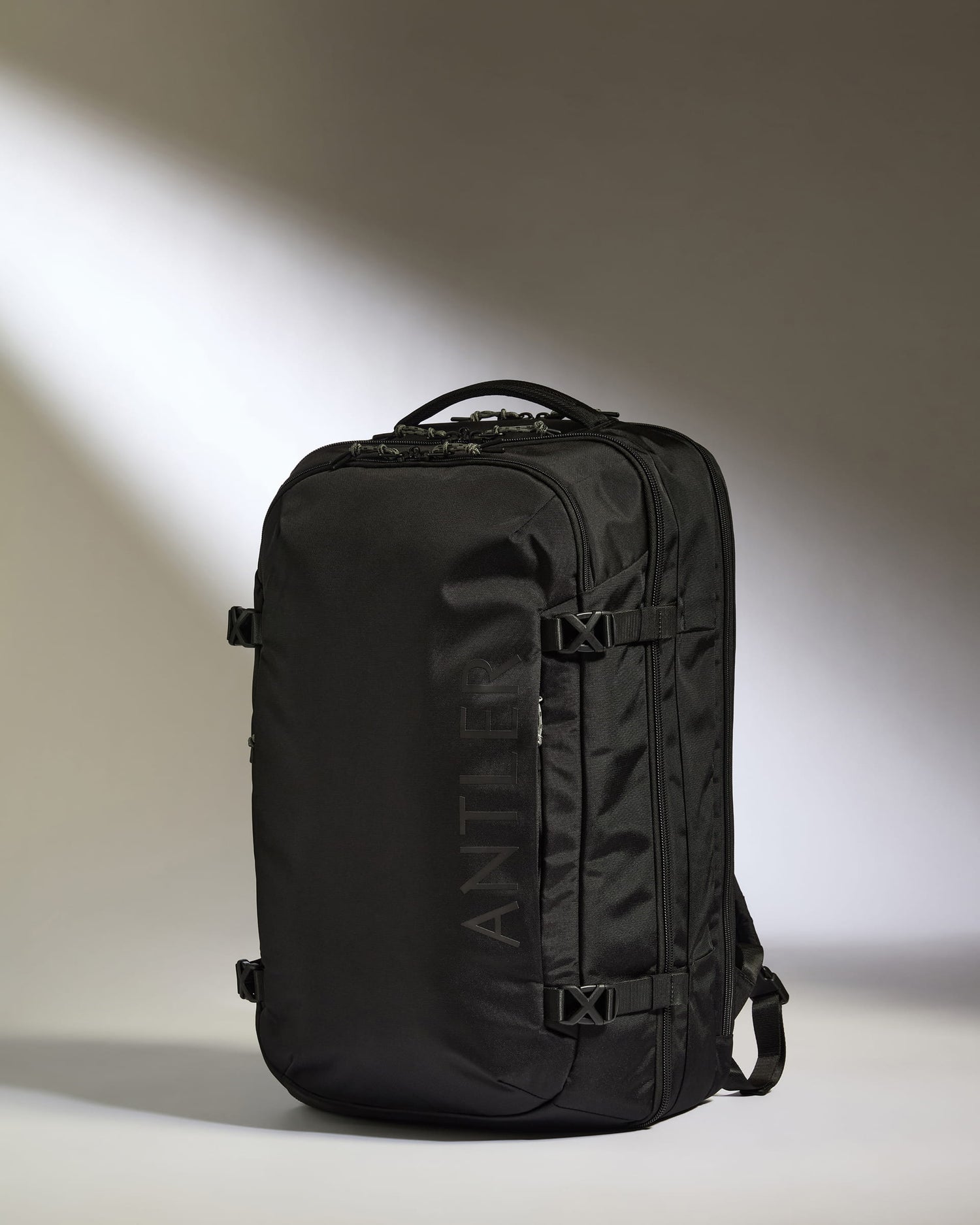 45l low profile travel backpack Away Active Convertible in Jet Black and stylish carry Discovery 45L Backpack in Meadow