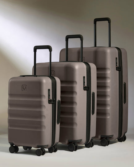 a group of luggage on wheels