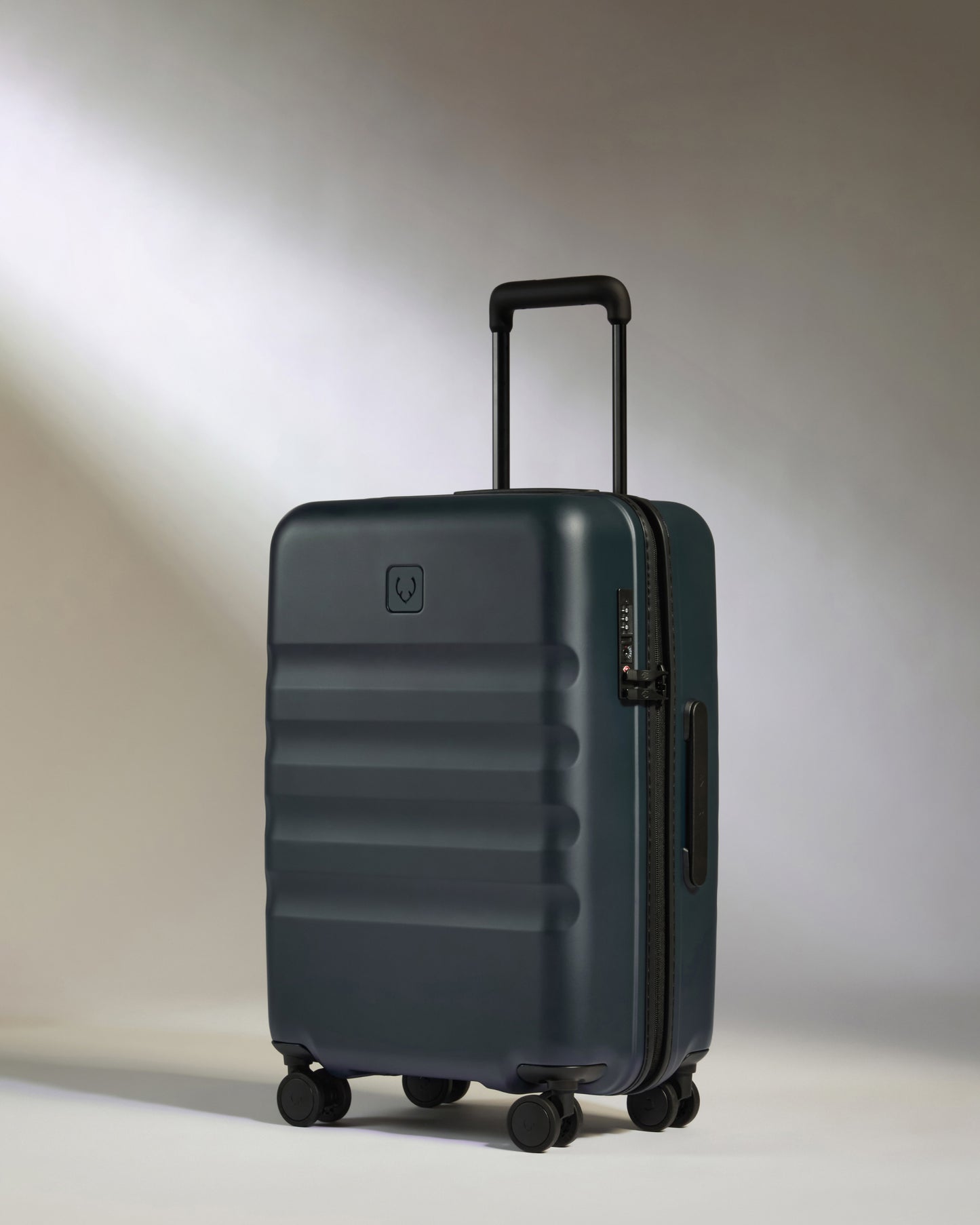 Icon Stripe Biggest Carry-On in Indigo Blue