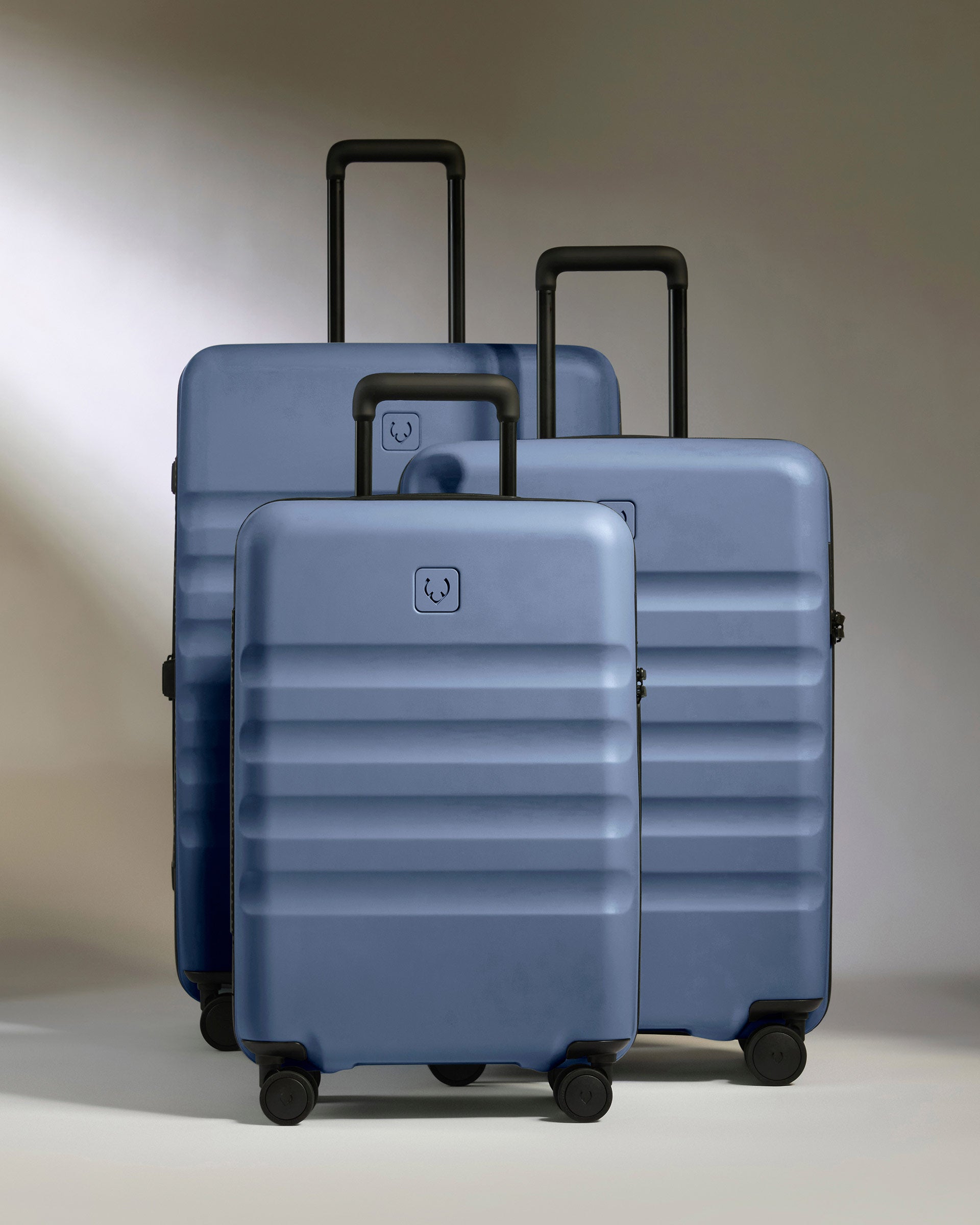 a group of luggage on wheels