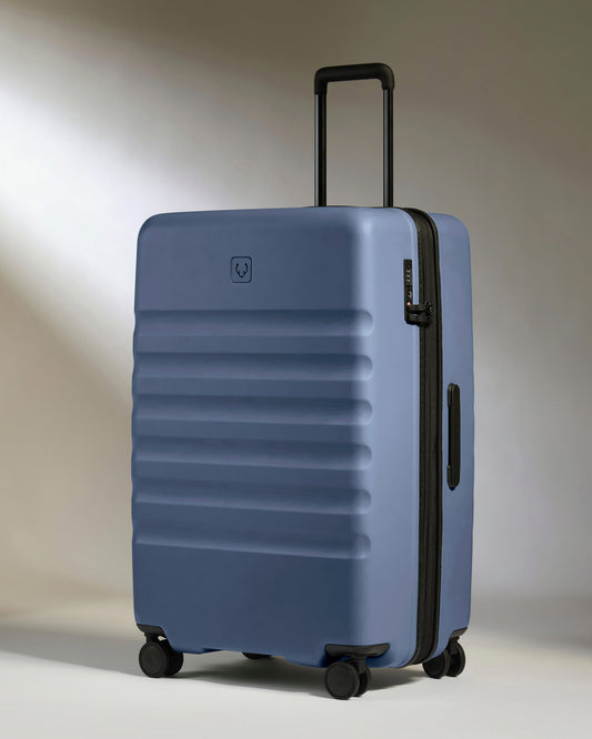 a blue suitcase with wheels
