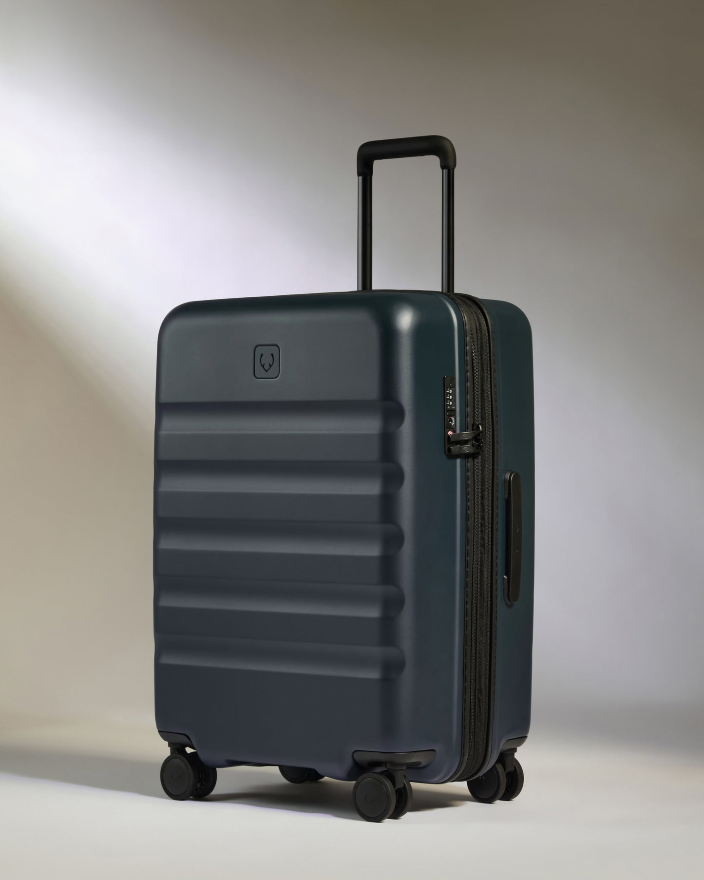 Icon Stripe Set with Biggest Carry-On in Indigo Blue