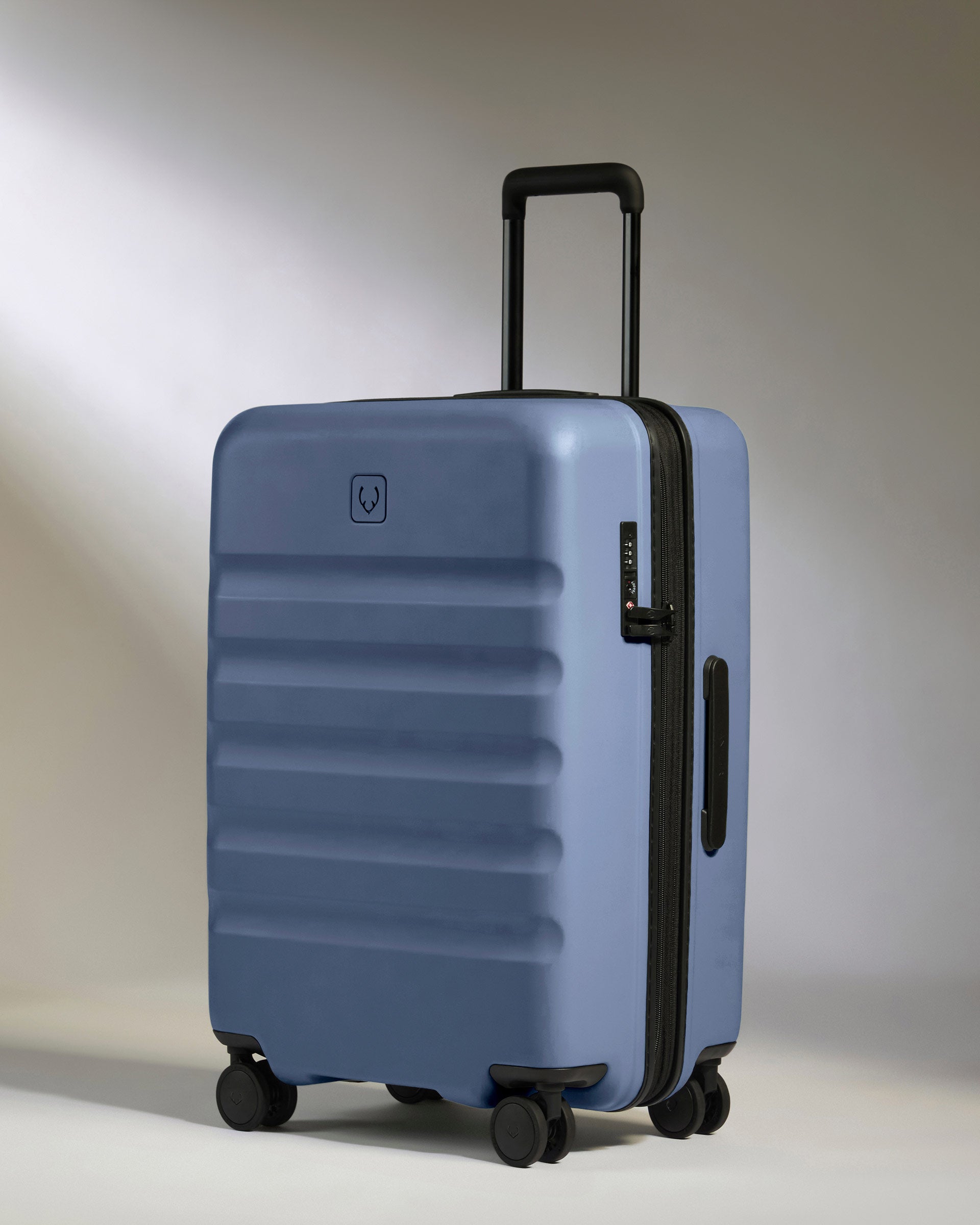Medium Suitcase in Blue - Icon Stripe | Lightweight & Hard Shell