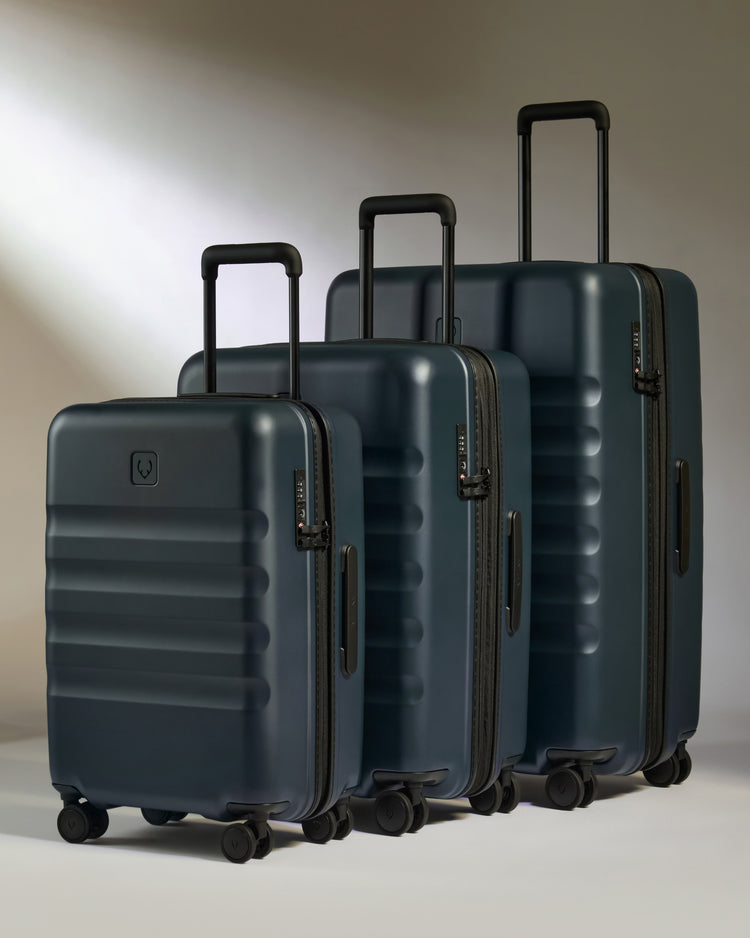 a group of luggage on wheels