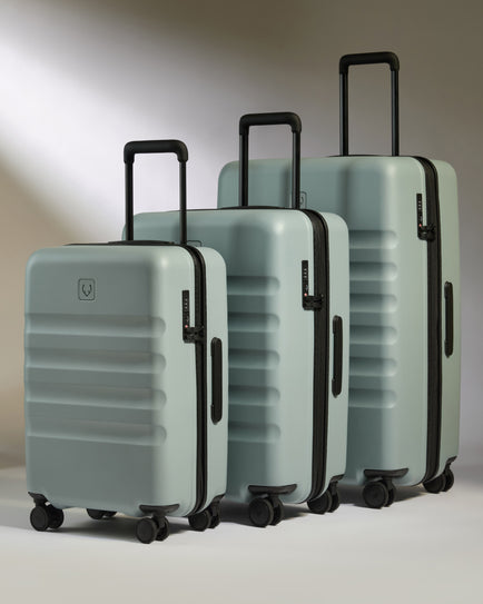 a group of luggage on wheels