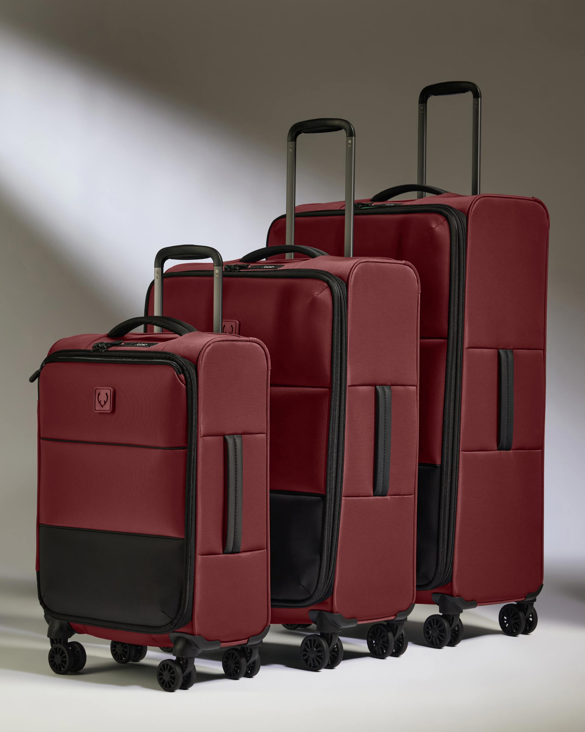 a group of luggage on wheels