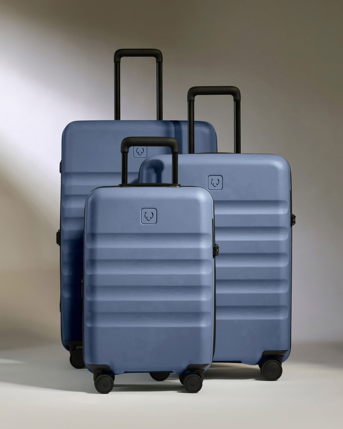 a group of luggage on wheels
