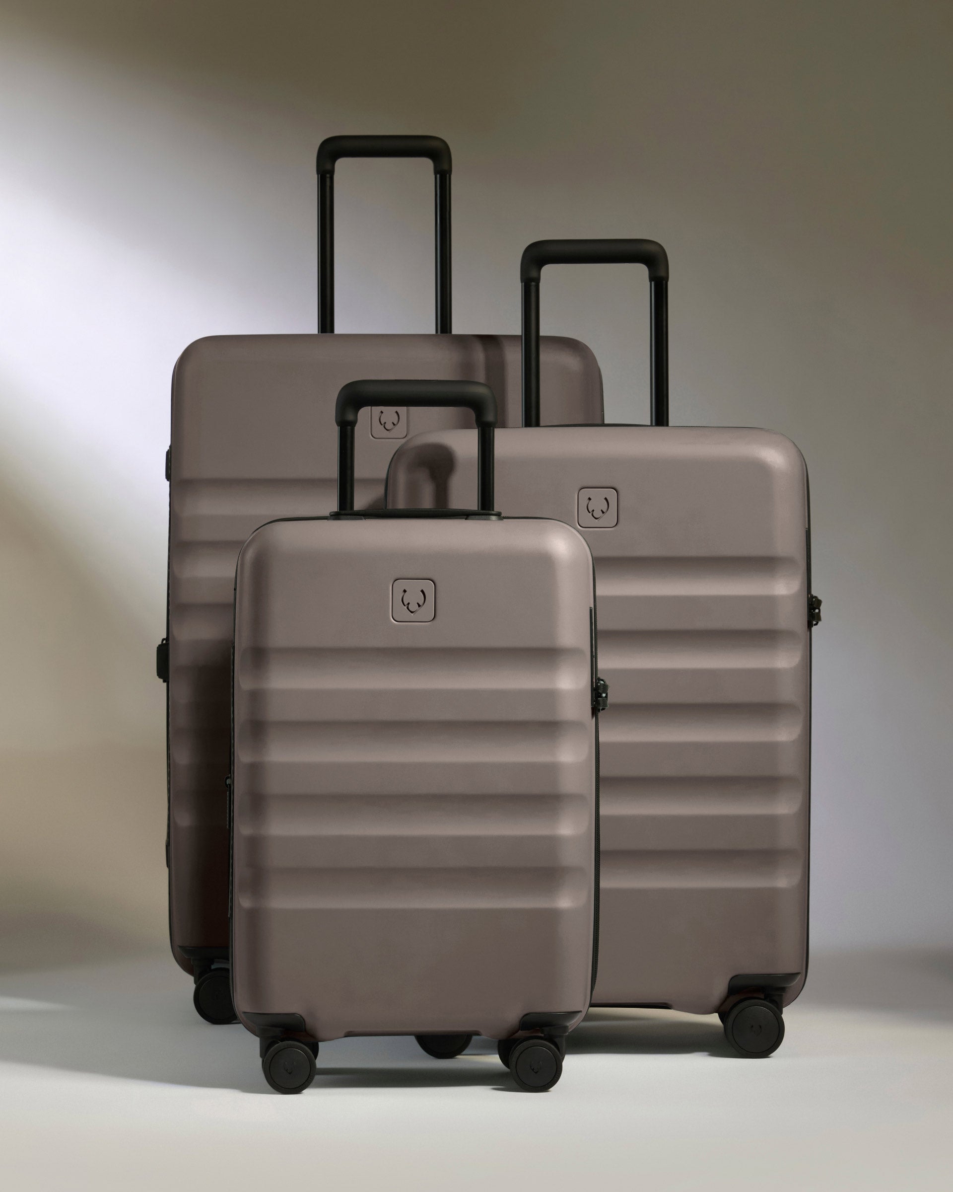 a group of luggage on wheels