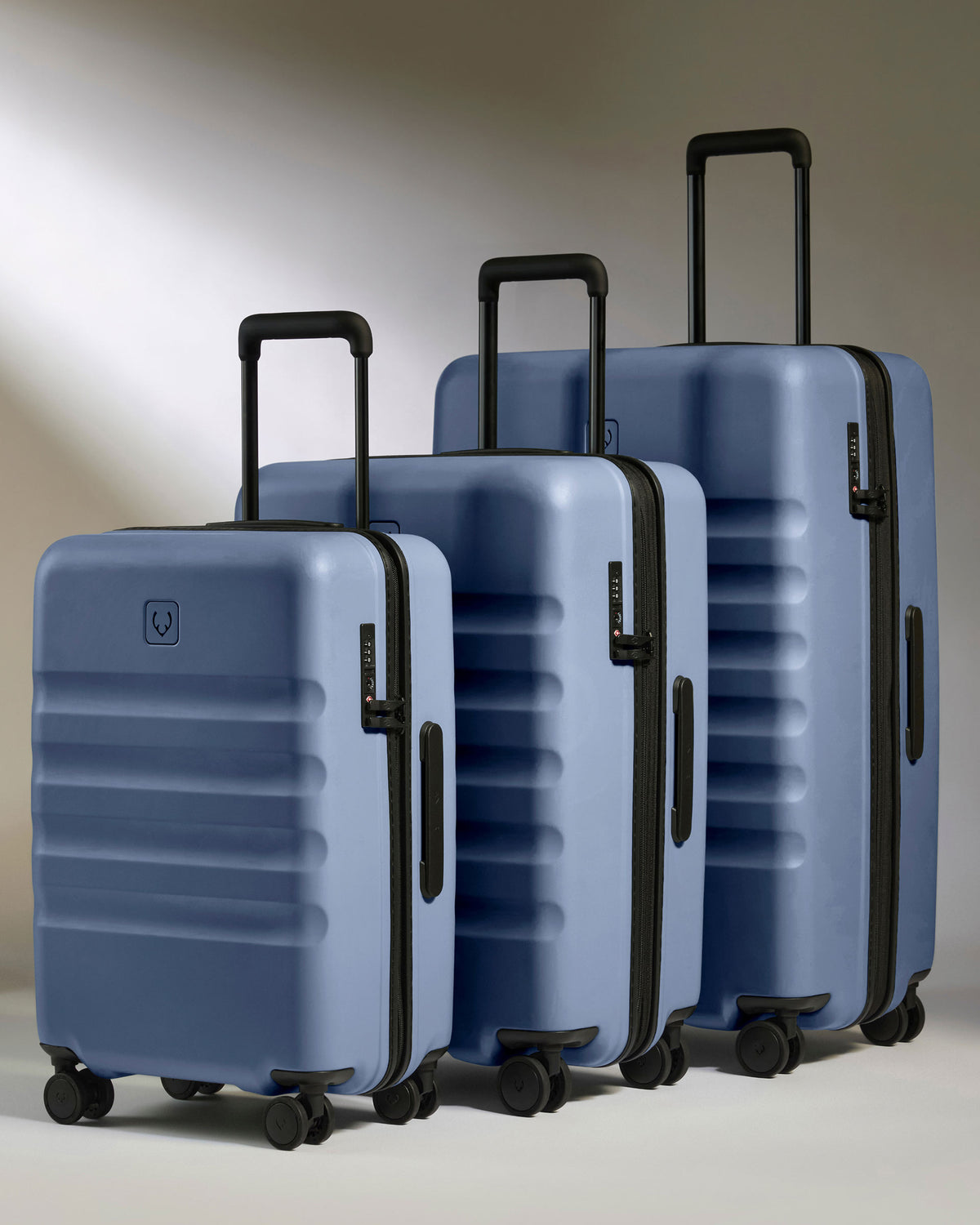 a group of luggage on wheels