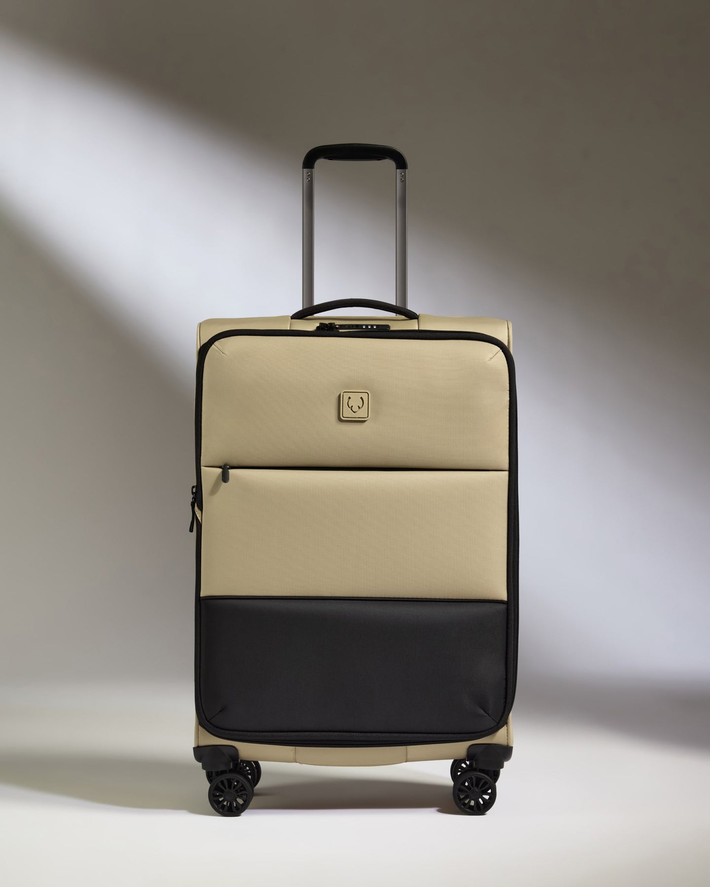 Lightest Medium Luggage in Sand - Soft Stripe 2.0