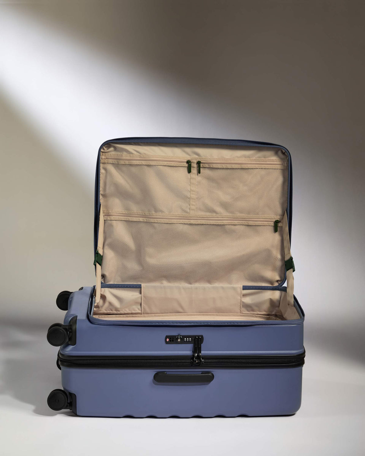 a blue suitcase with wheels