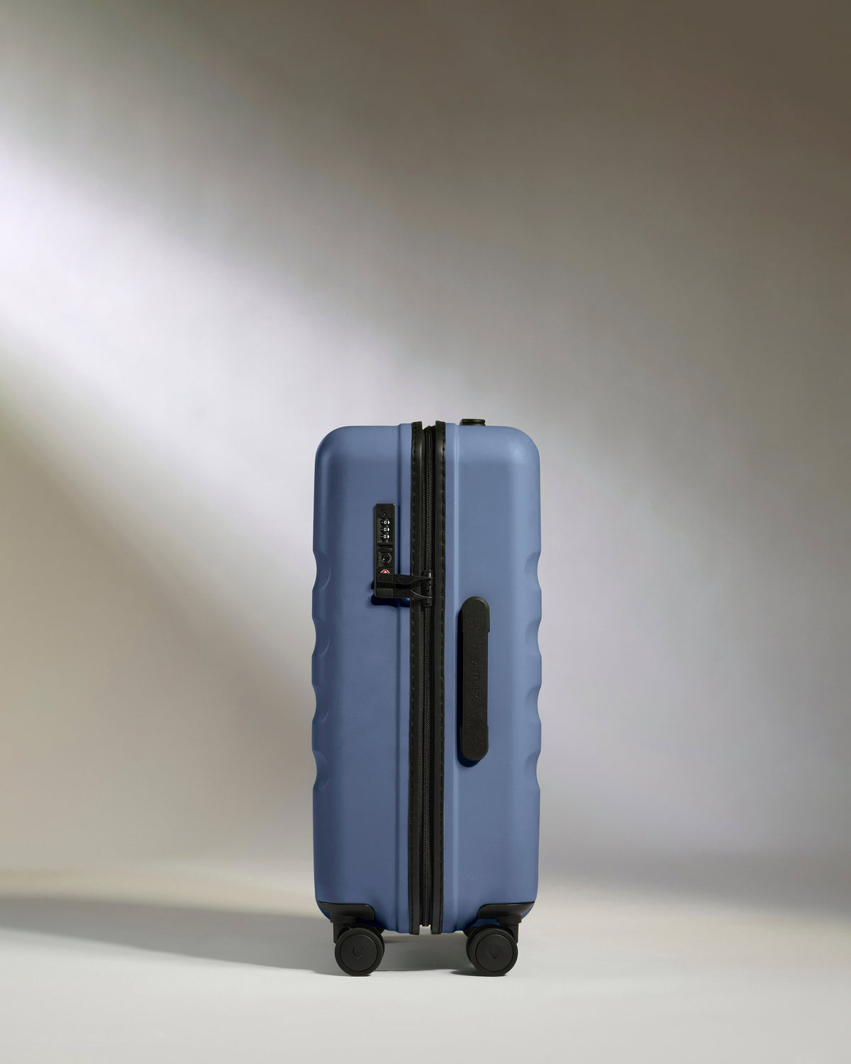 a blue suitcase with wheels