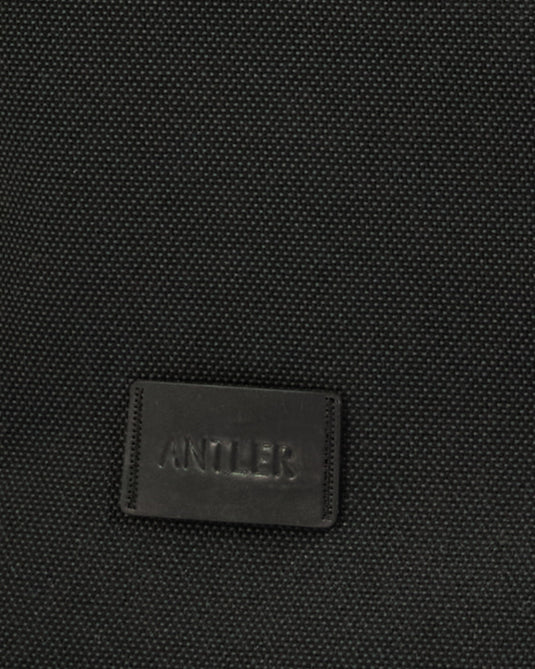a black leather label on a black surface