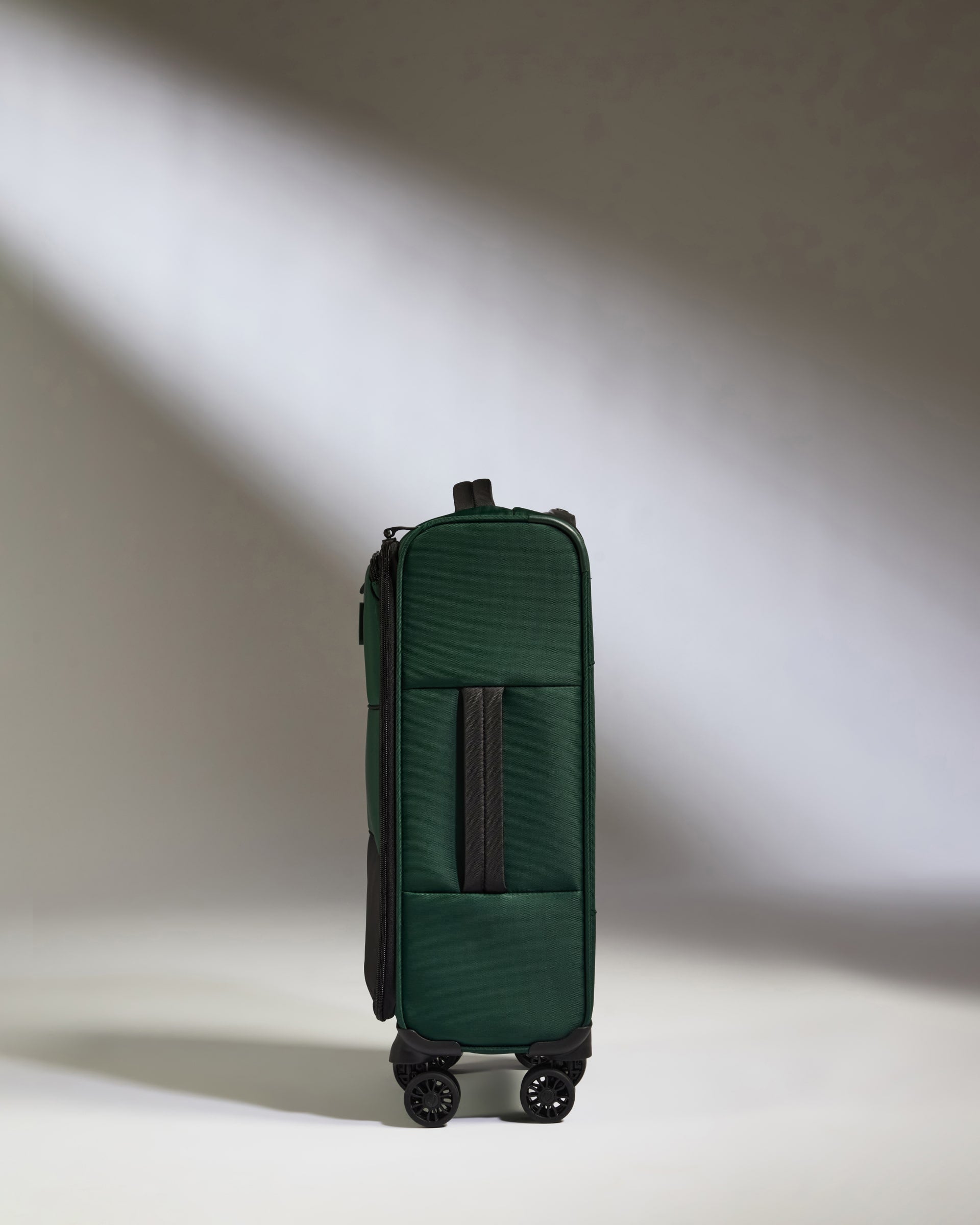 a green suitcase with wheels